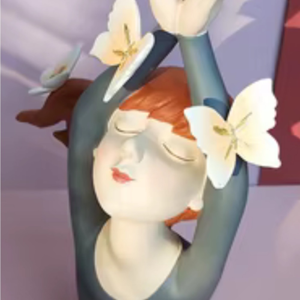 Elegant Blue and White Figurine with Floral Accents